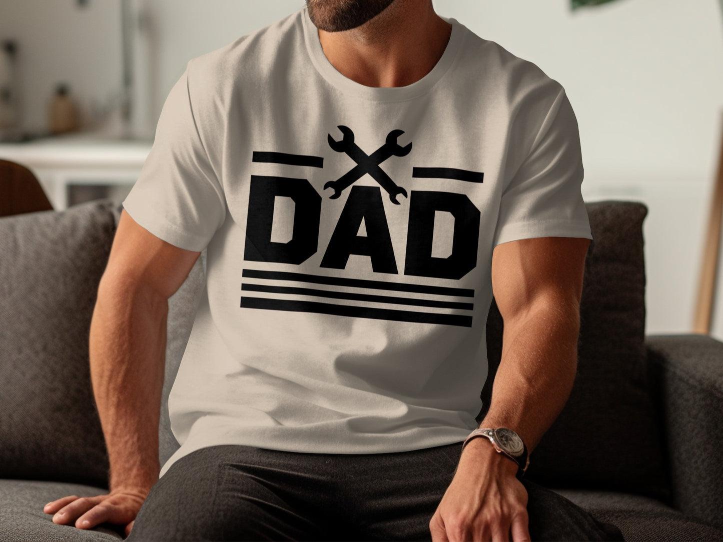 Black t-shirt with "DAD" text and crossed wrenches, worn by a man.
