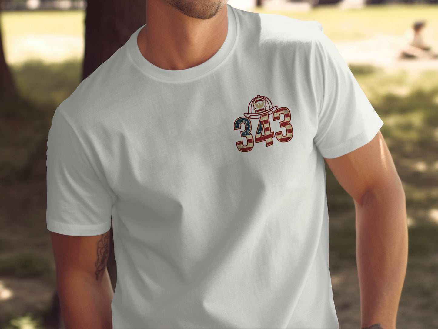 White t-shirt with emblem of firefighter helmet and American flag "343".