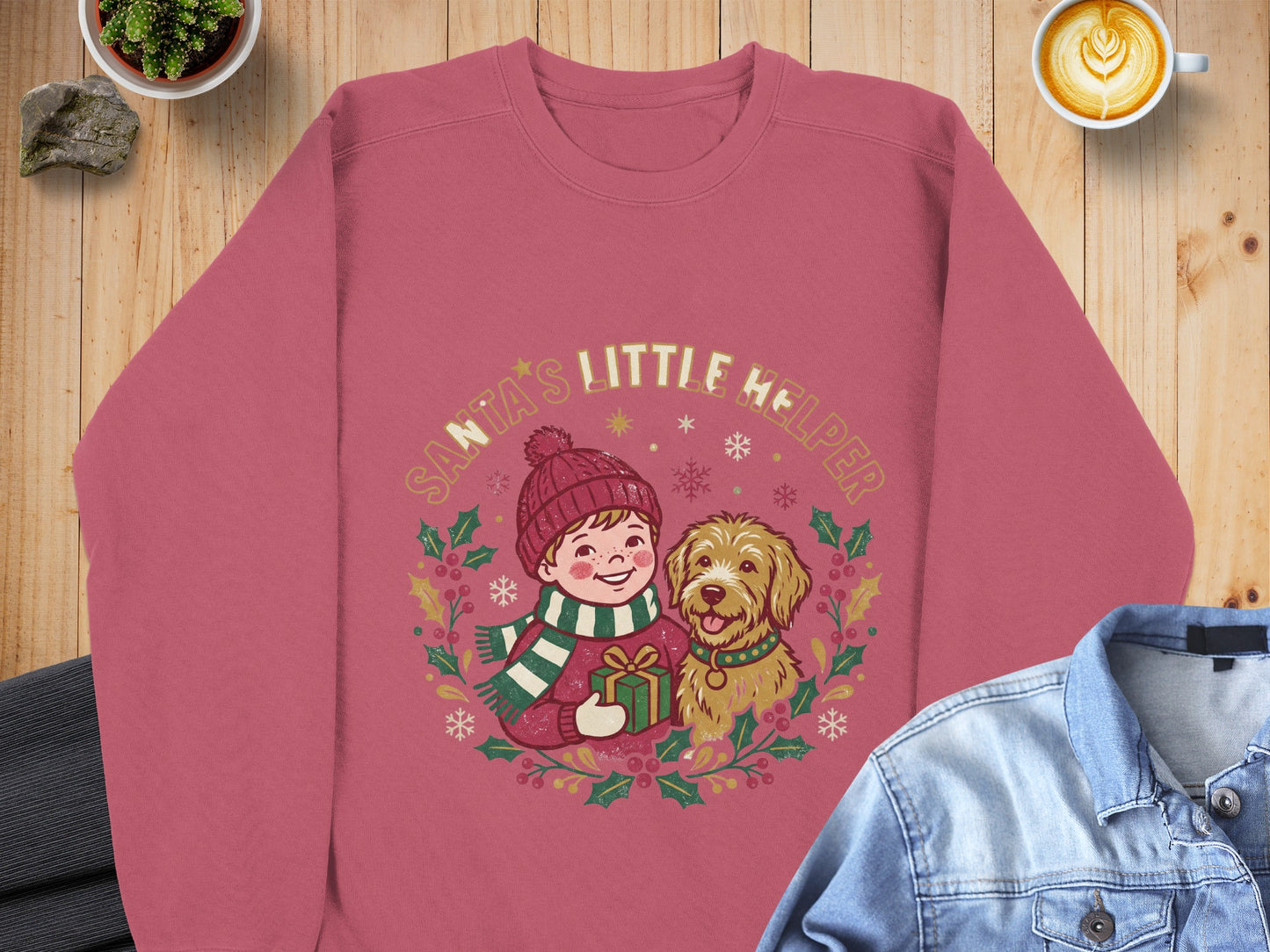 Sweatshirt with "Santa's Little Helper" graphic of a child and dog holding a gift.