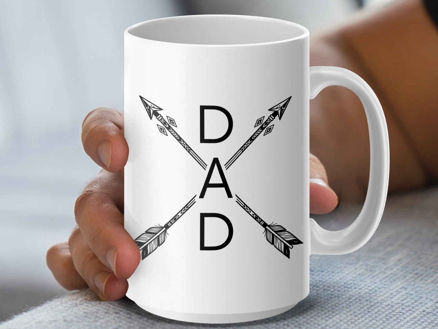 White mug with crossed arrows and "DAD" text.