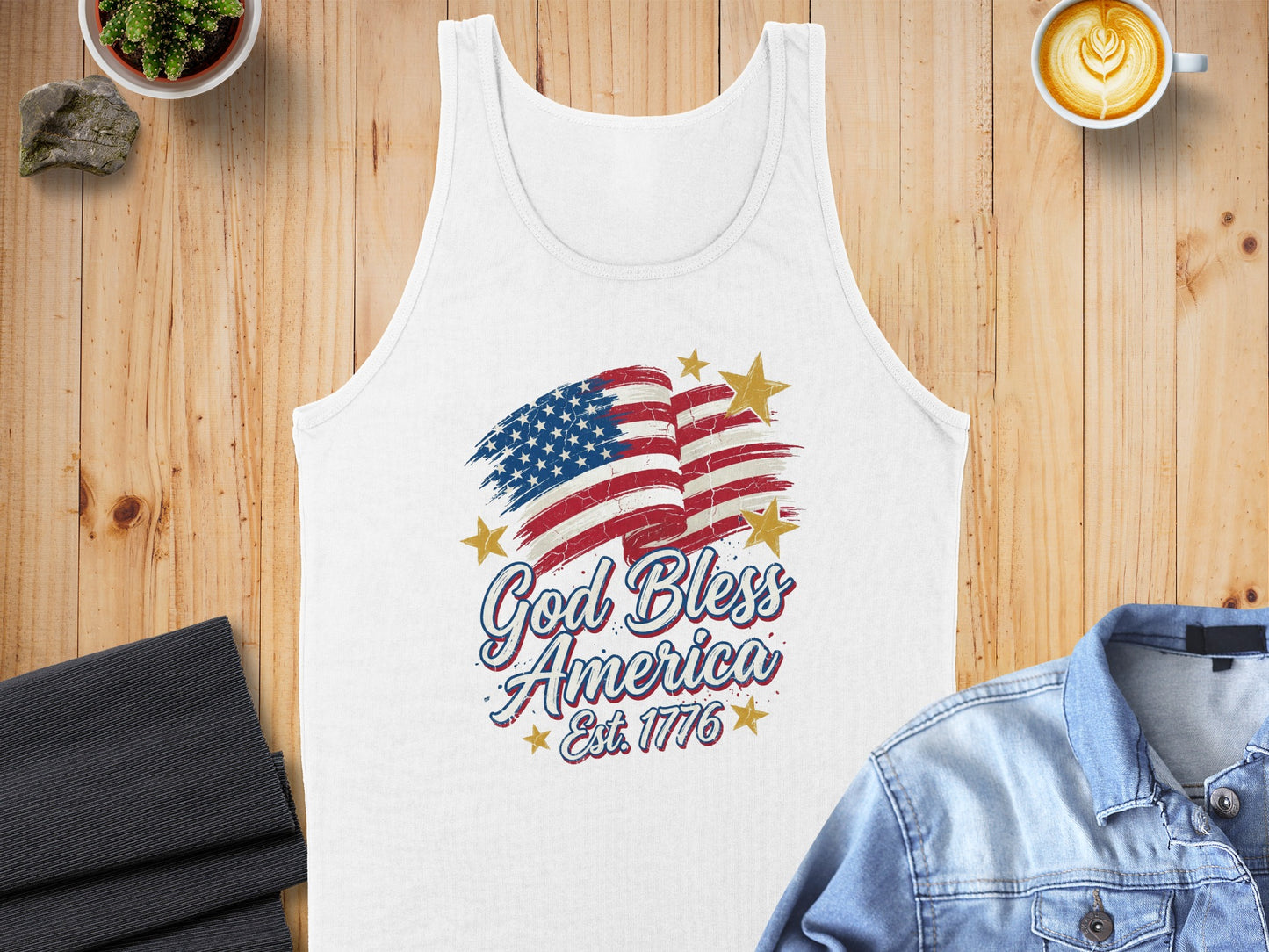 White tank top with "God Bless America Est. 1776" and distressed US flag graphic.