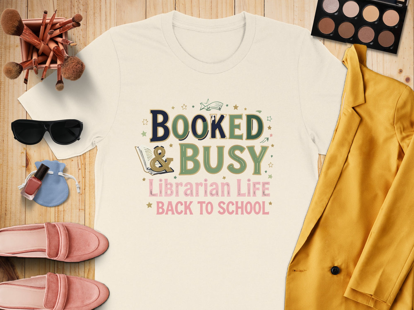 Cream t-shirt with "Booked & Busy Librarian Life Back to School" text.