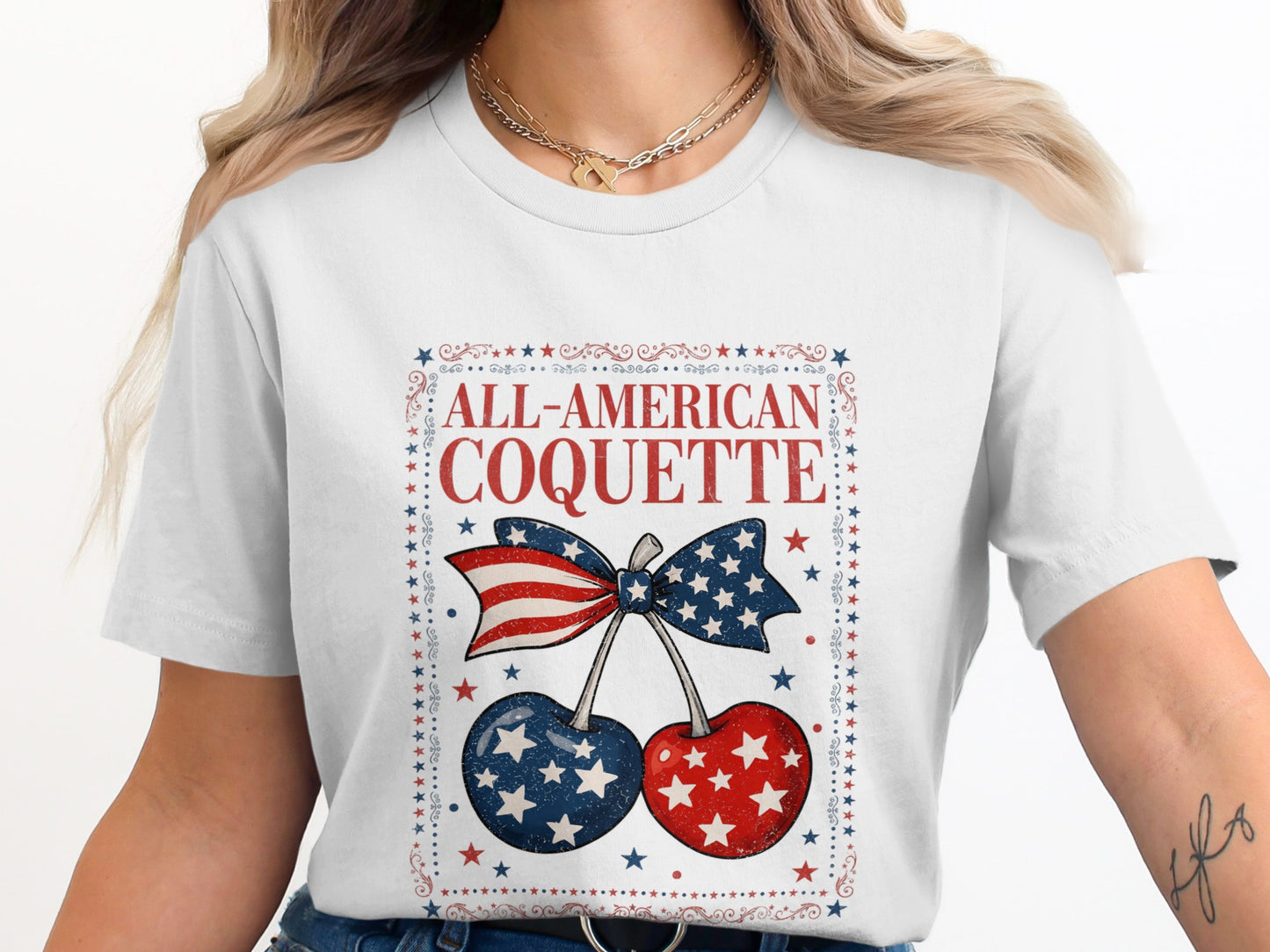 White t-shirt with "All-American Coquette" and patriotic cherries.