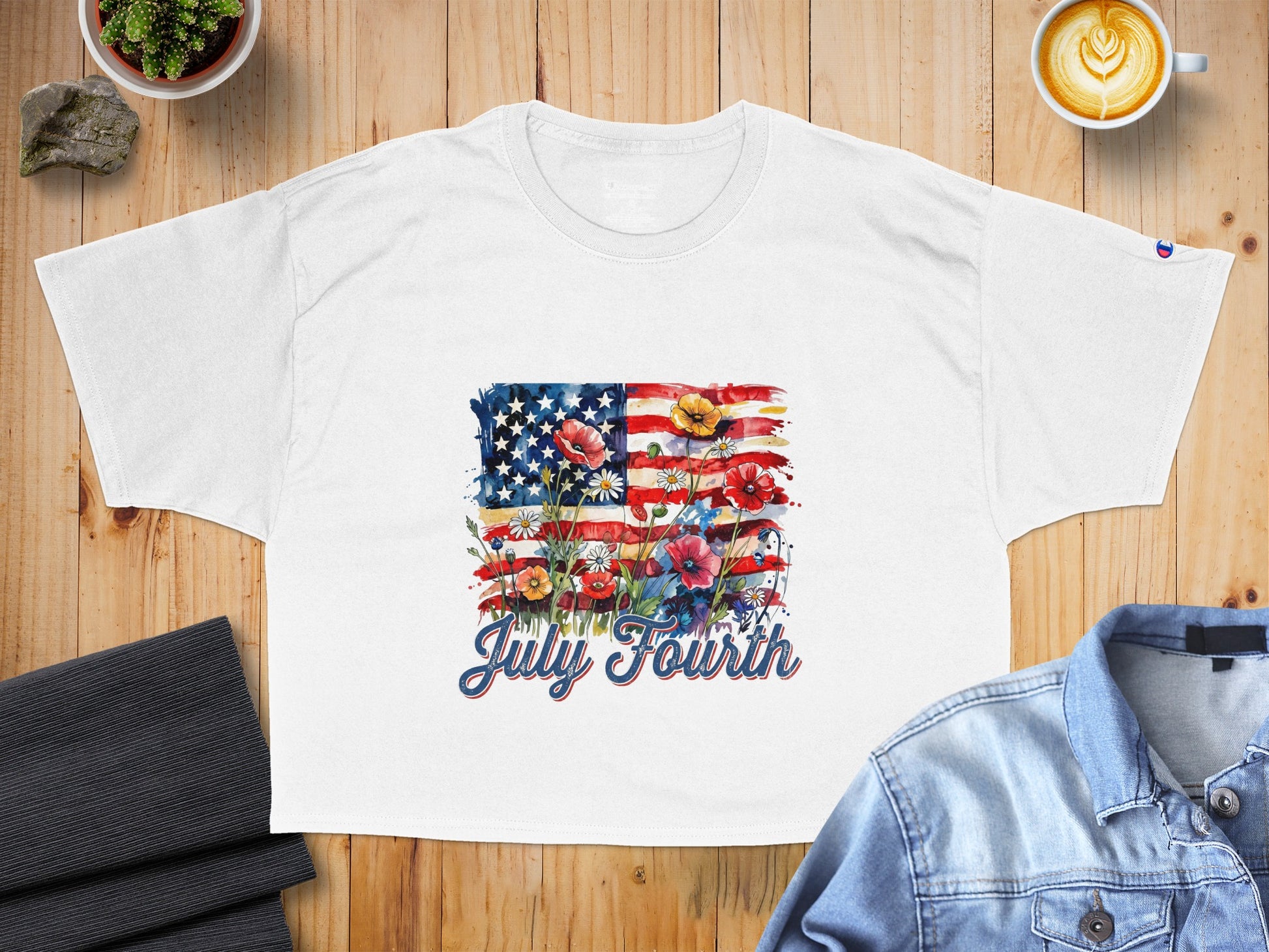 White t-shirt with American flag and floral design, says "July Fourth".