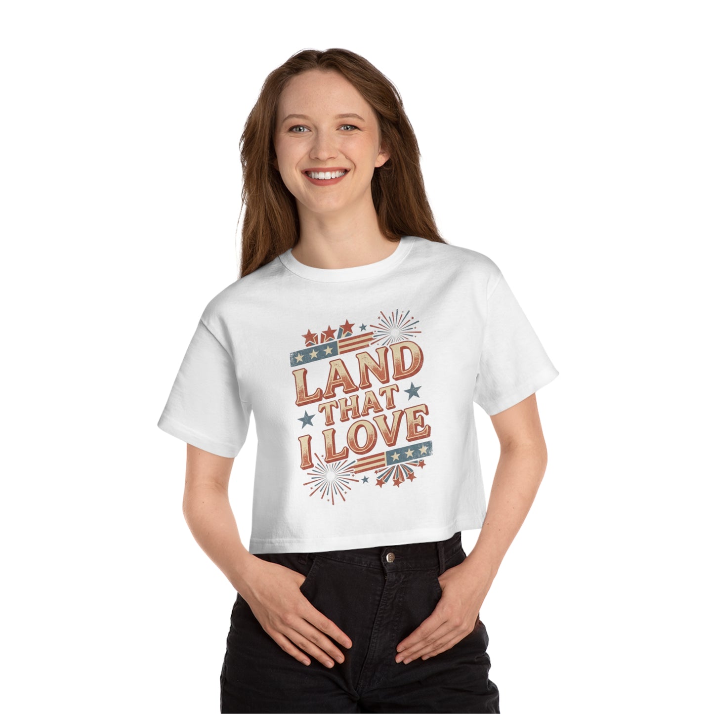 White crop top with "Land That I Love" text and patriotic graphics.