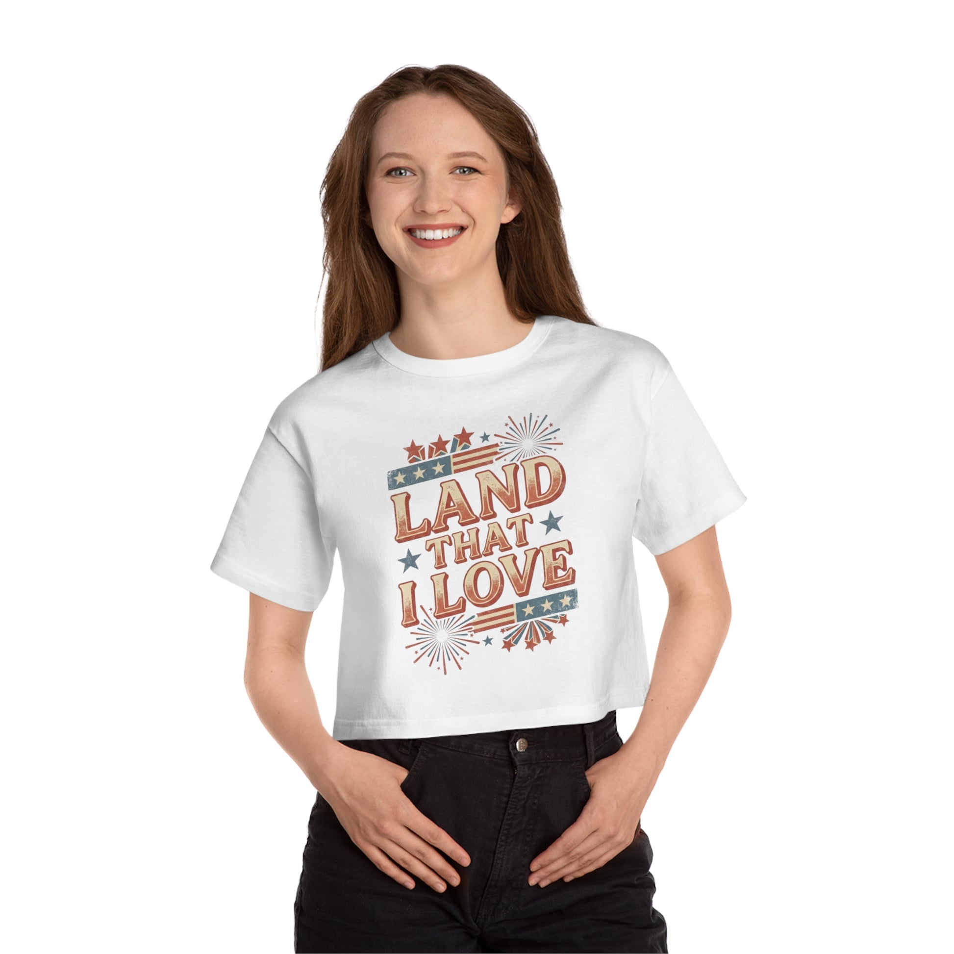 White crop top with "Land That I Love" text and patriotic graphics.