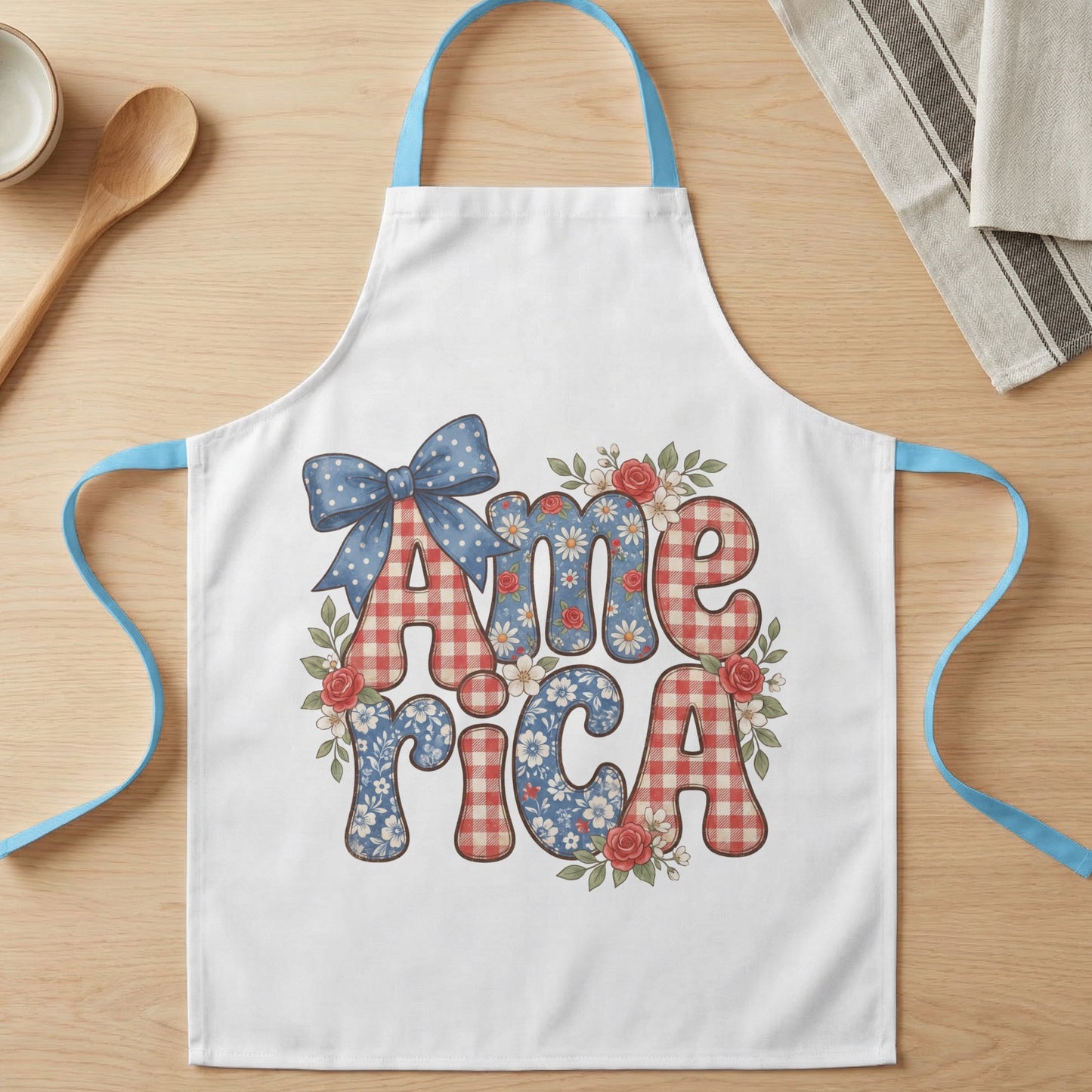 White apron with "America" text in red gingham and floral patterns.
