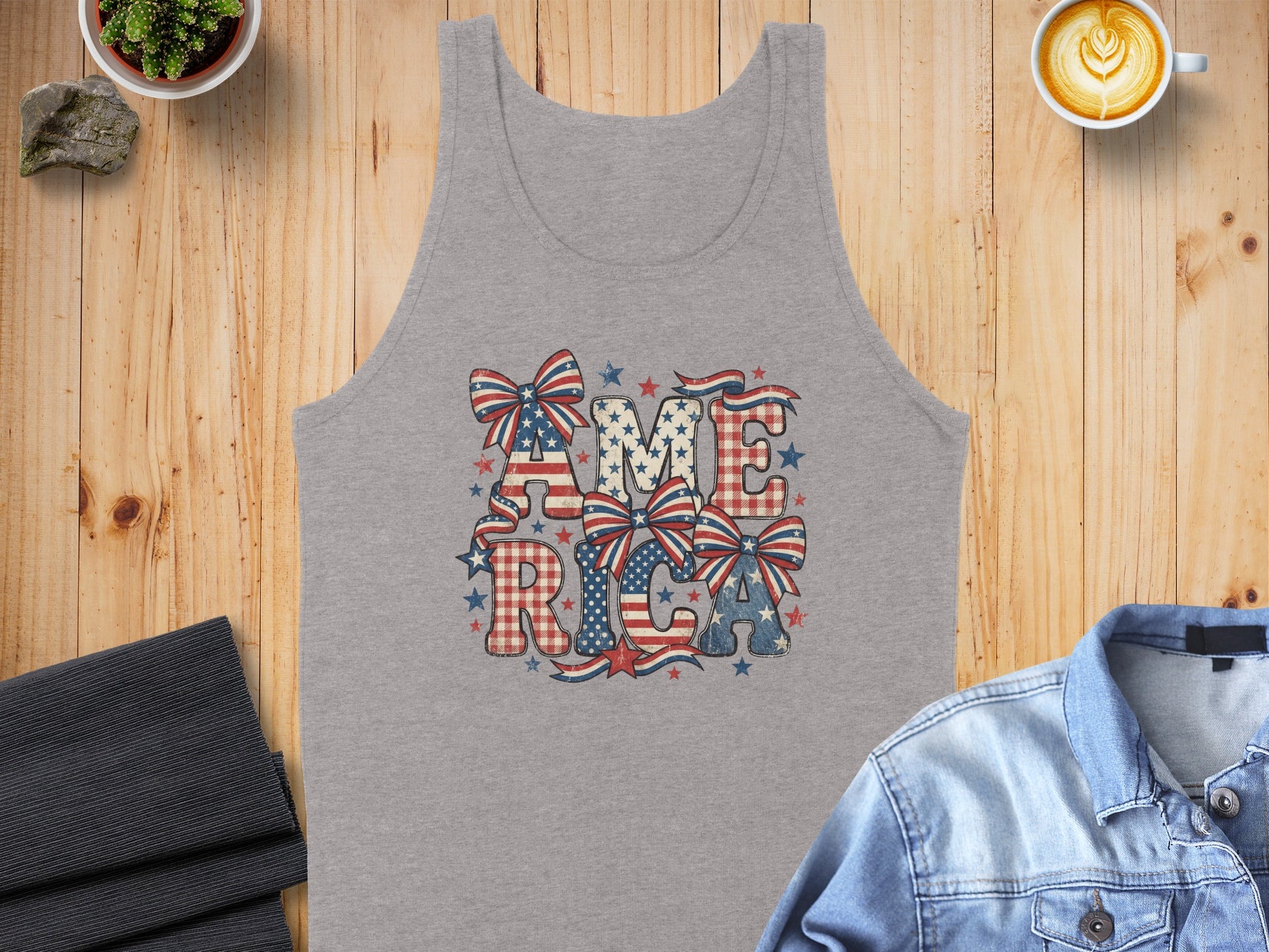 Grey tank top with "AMERICA" in faded patriotic patterns and bows.