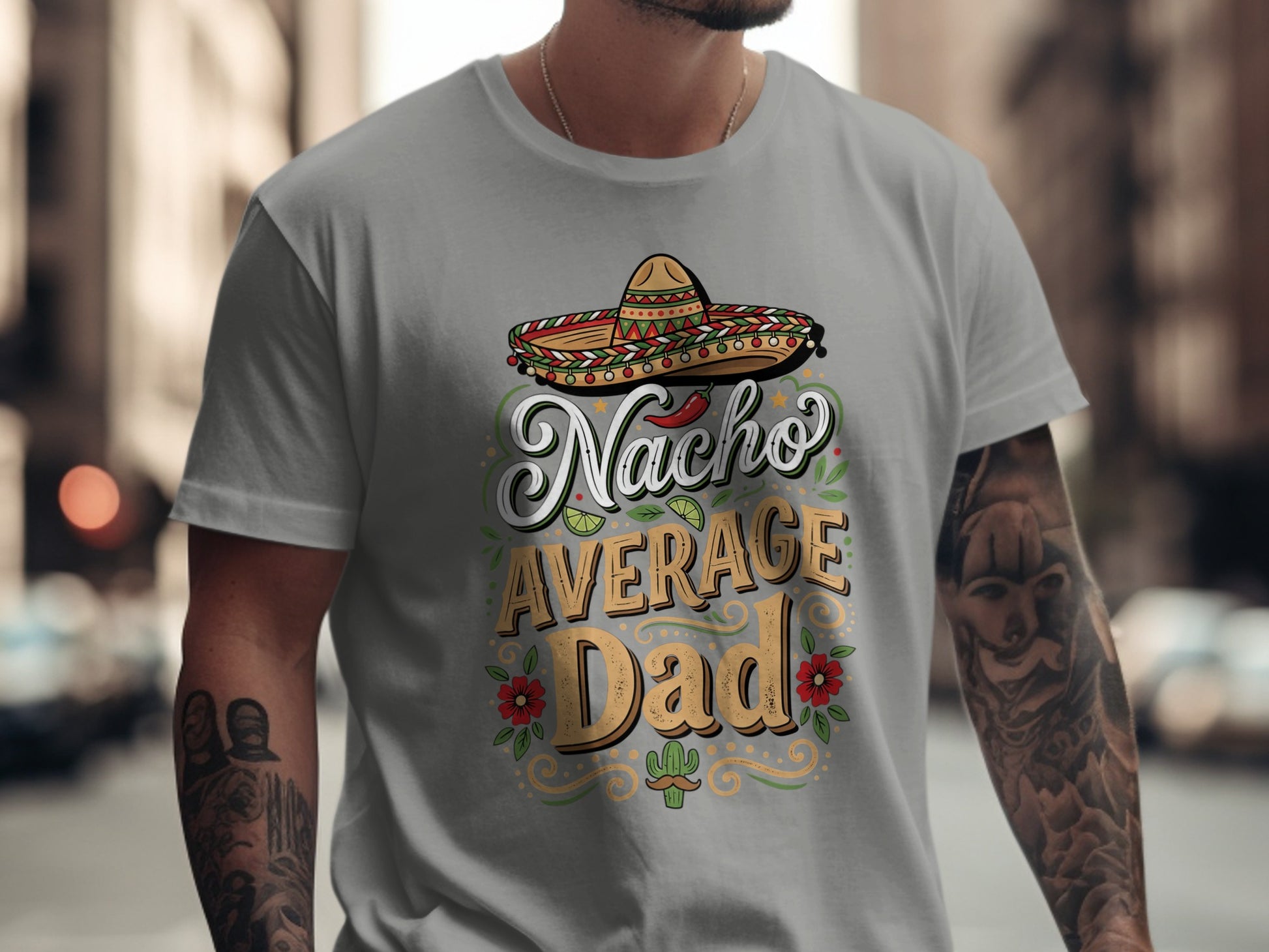 Nacho Average Dad text with sombrero and desert plants on a gray t-shirt.