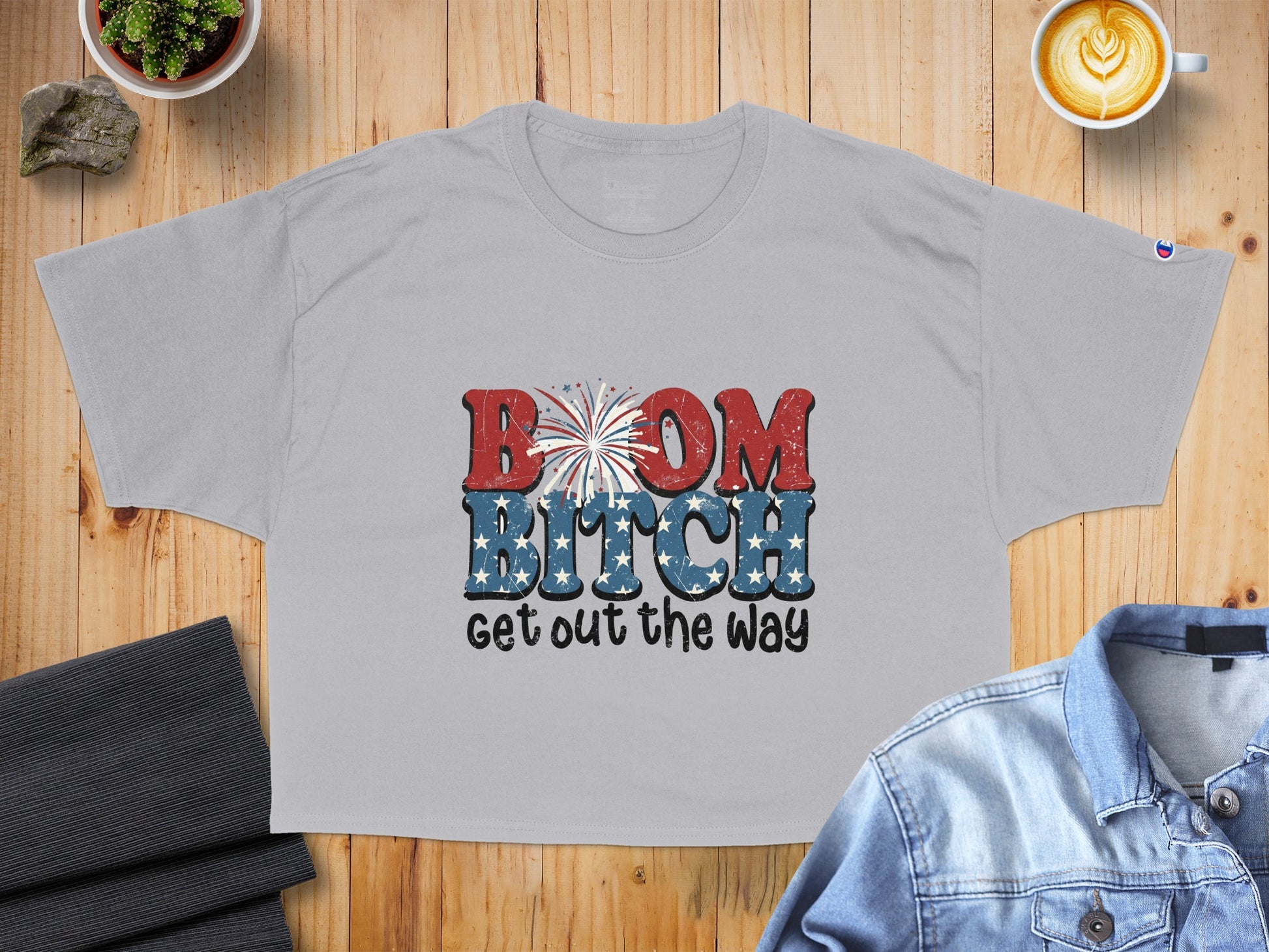 Light grey t-shirt with "BOOM BITCH get out the way" graphic.