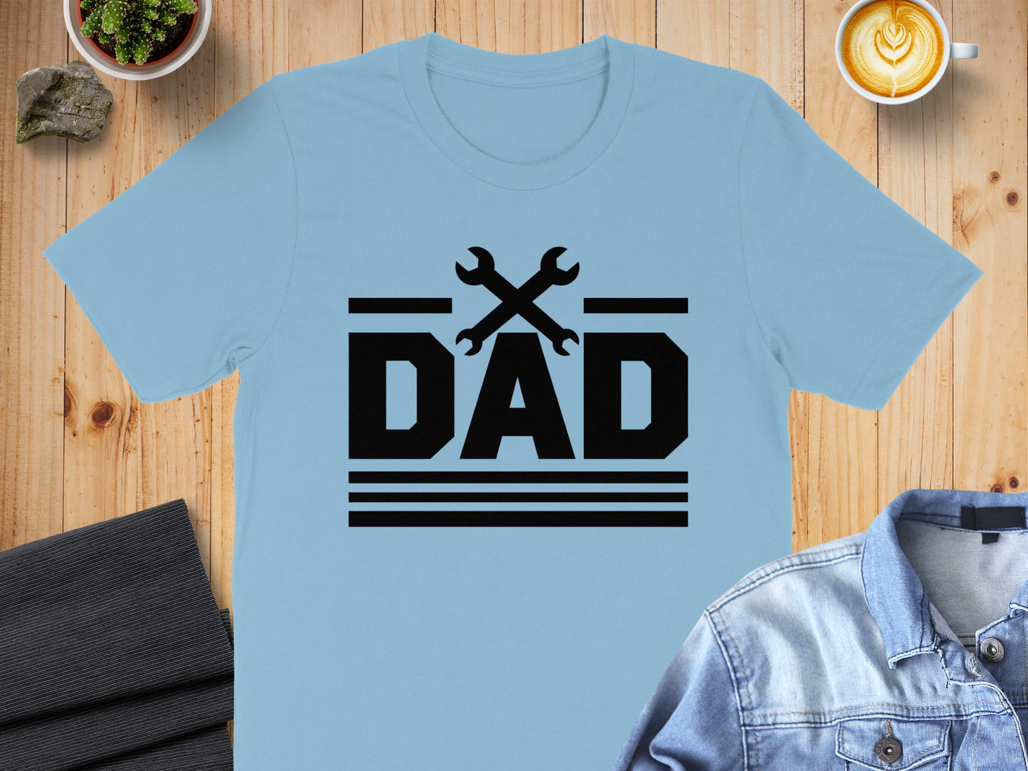 Light blue t-shirt with black "DAD" text and crossed wrenches graphic.