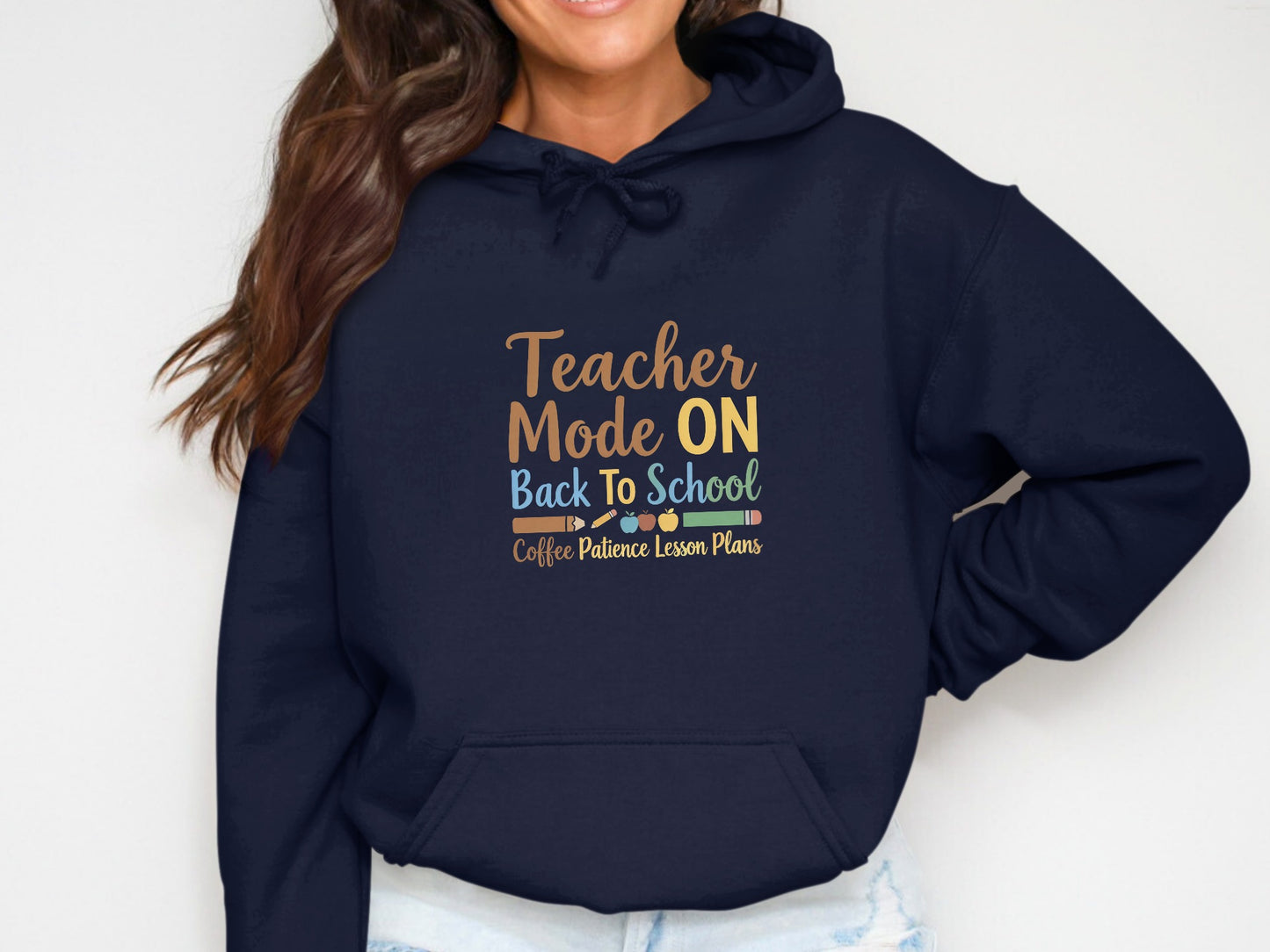 Navy hoodie with "Teacher Mode ON Back To School Coffee Patience Lesson Plans" text.