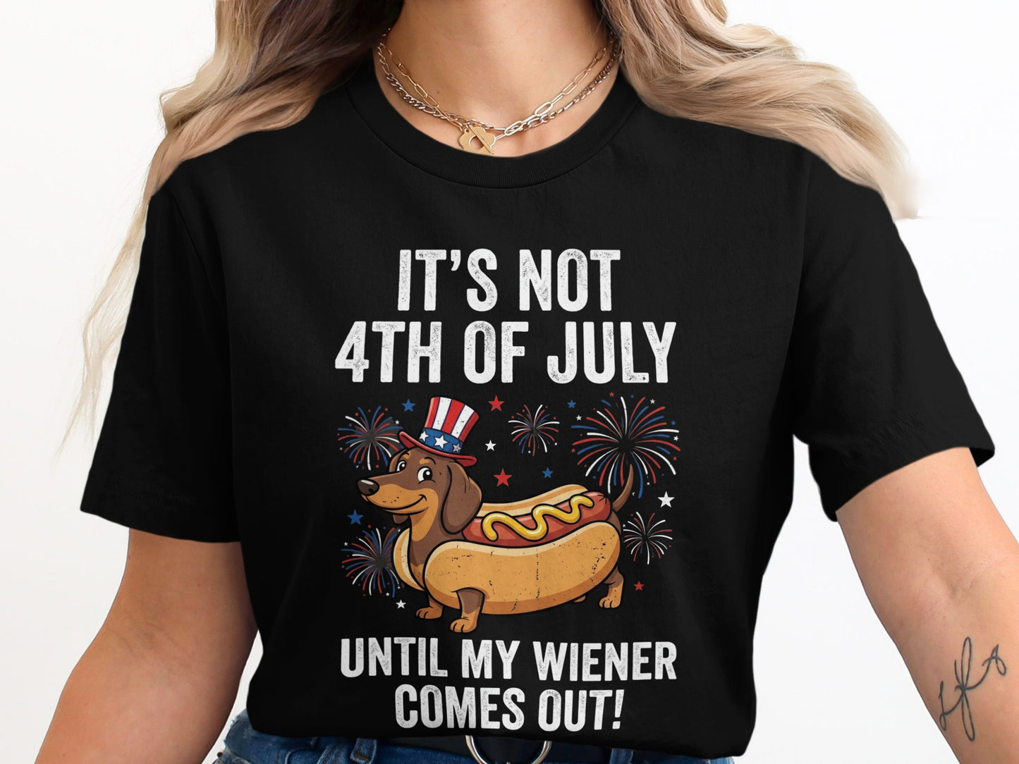 Black t-shirt with dachshund in hot dog bun, fireworks, and text.