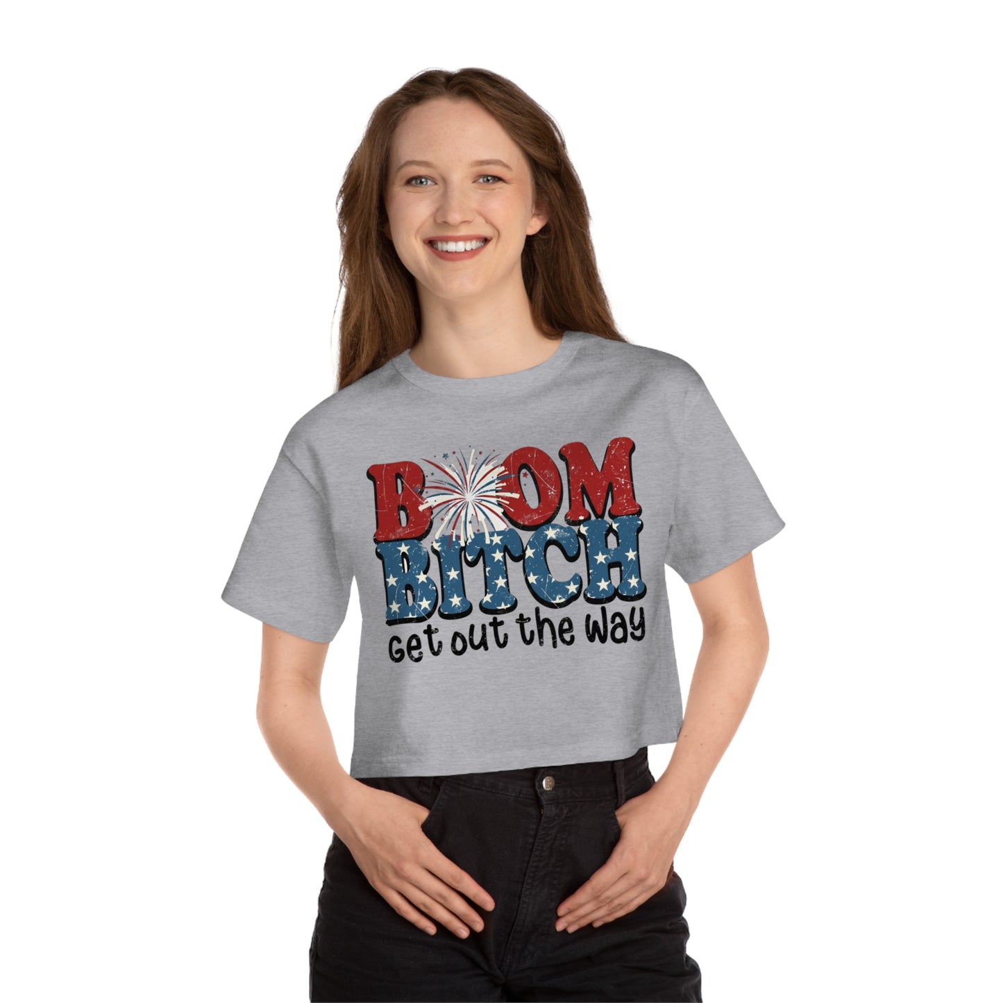 Grey cropped t-shirt with "Boom Bitch" and fireworks, patriotic stars, and "get out the way" text.