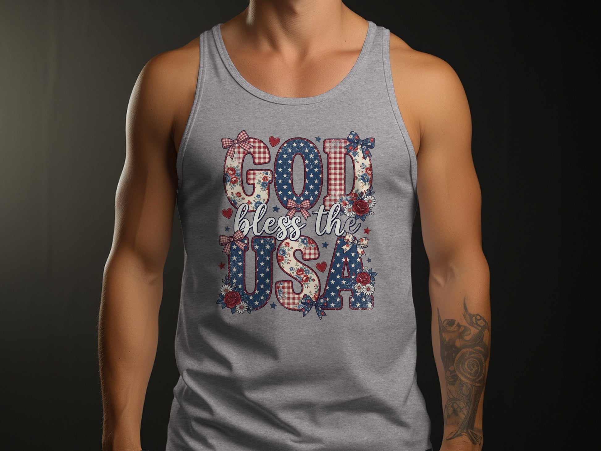 Grey tank top with "God bless the USA" in patriotic floral and gingham patterns.