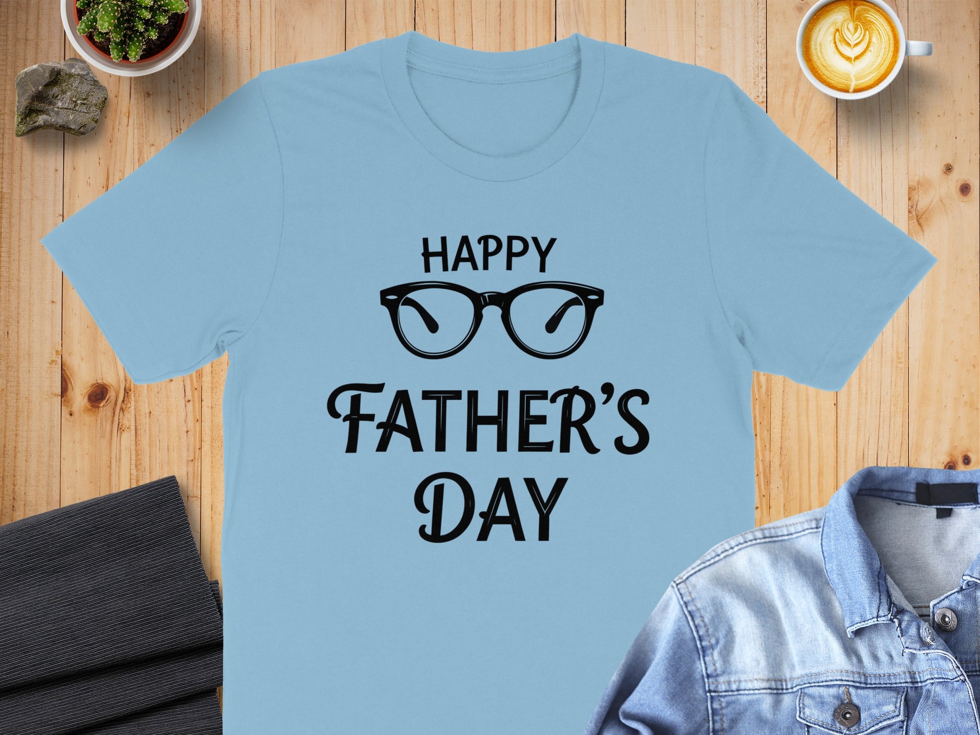 Light blue t-shirt with "Happy Father's Day" text and glasses graphic.