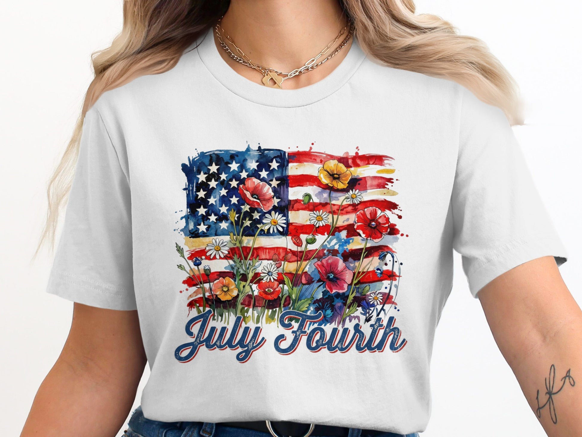 White t-shirt with watercolor US flag and July Fourth text.