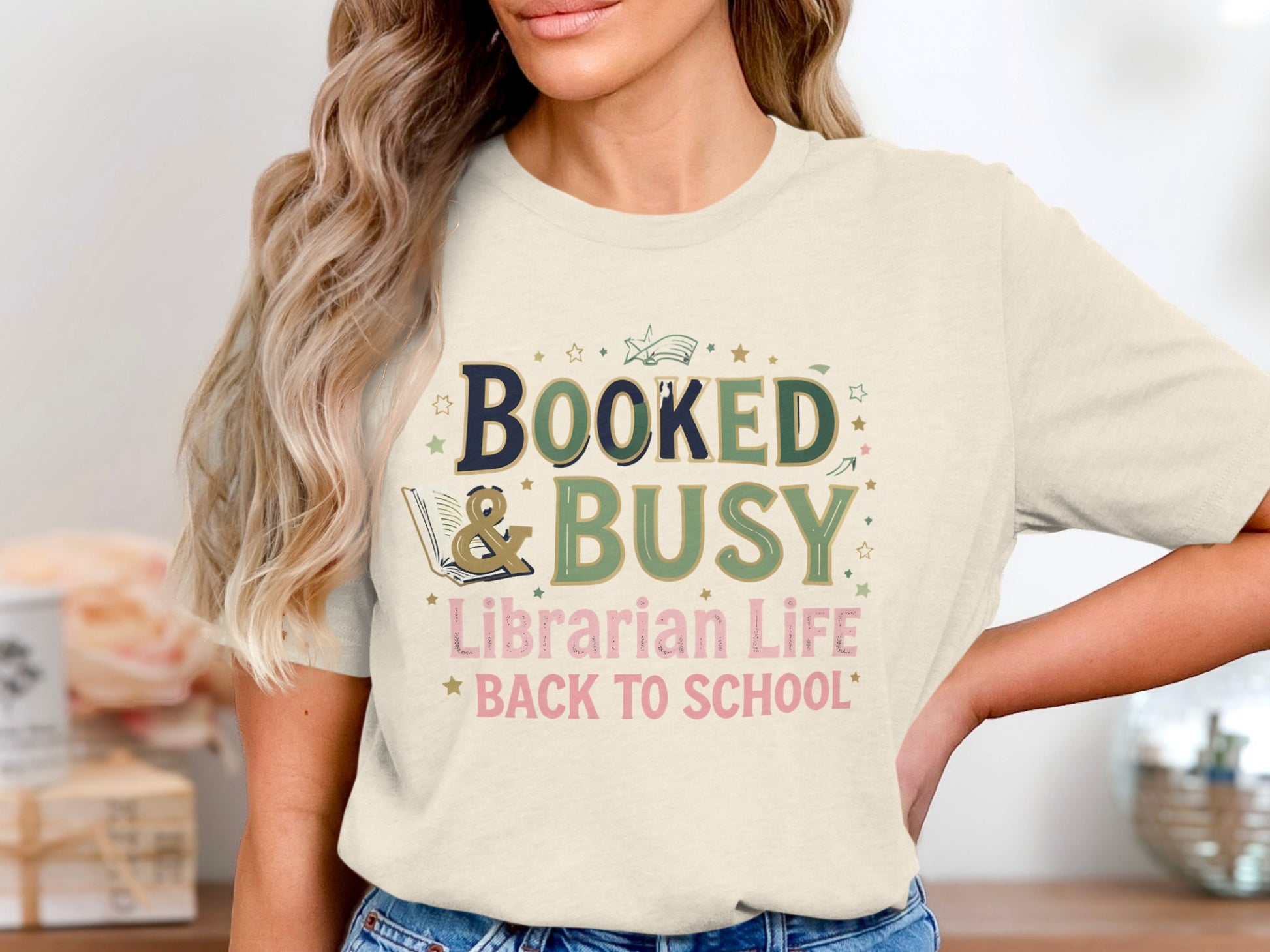Cream t-shirt with "Booked & Busy Librarian Life Back to School" text.