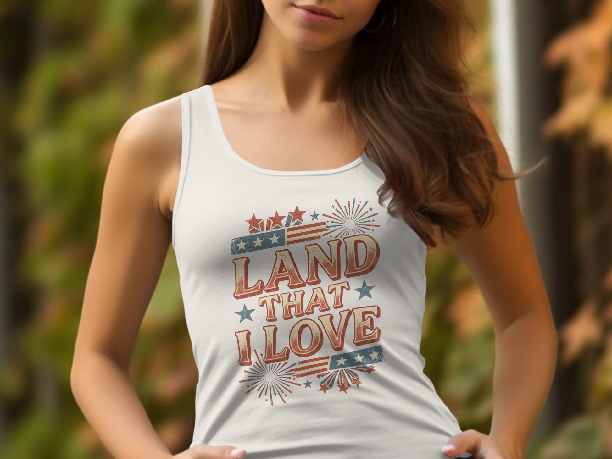 White tank top with "Land That I Love" text and American flag elements.