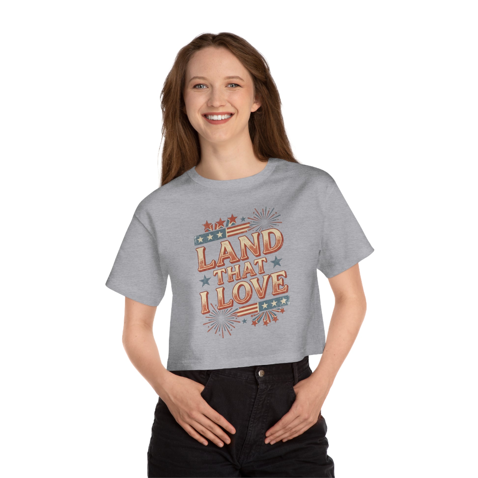Gray cropped t-shirt with red, white, and blue "Land That I Love" patriotic graphic.