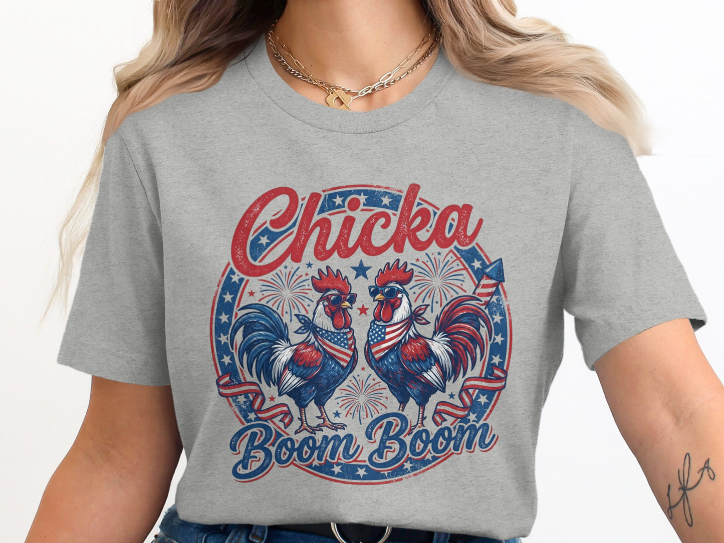 Two roosters wearing sunglasses with American flag bandanas on a t-shirt.