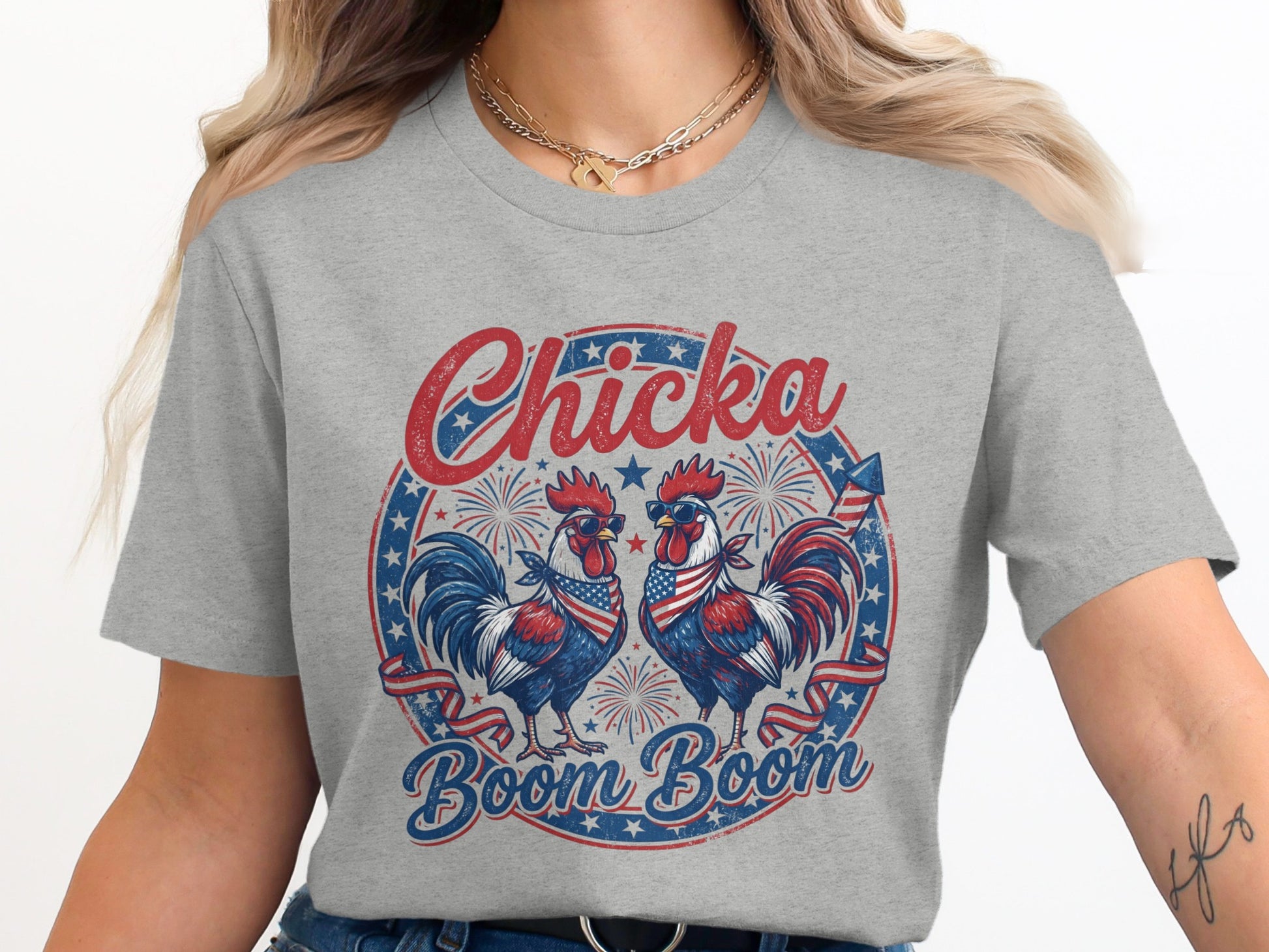 Two roosters wearing sunglasses with American flag bandanas on a t-shirt.