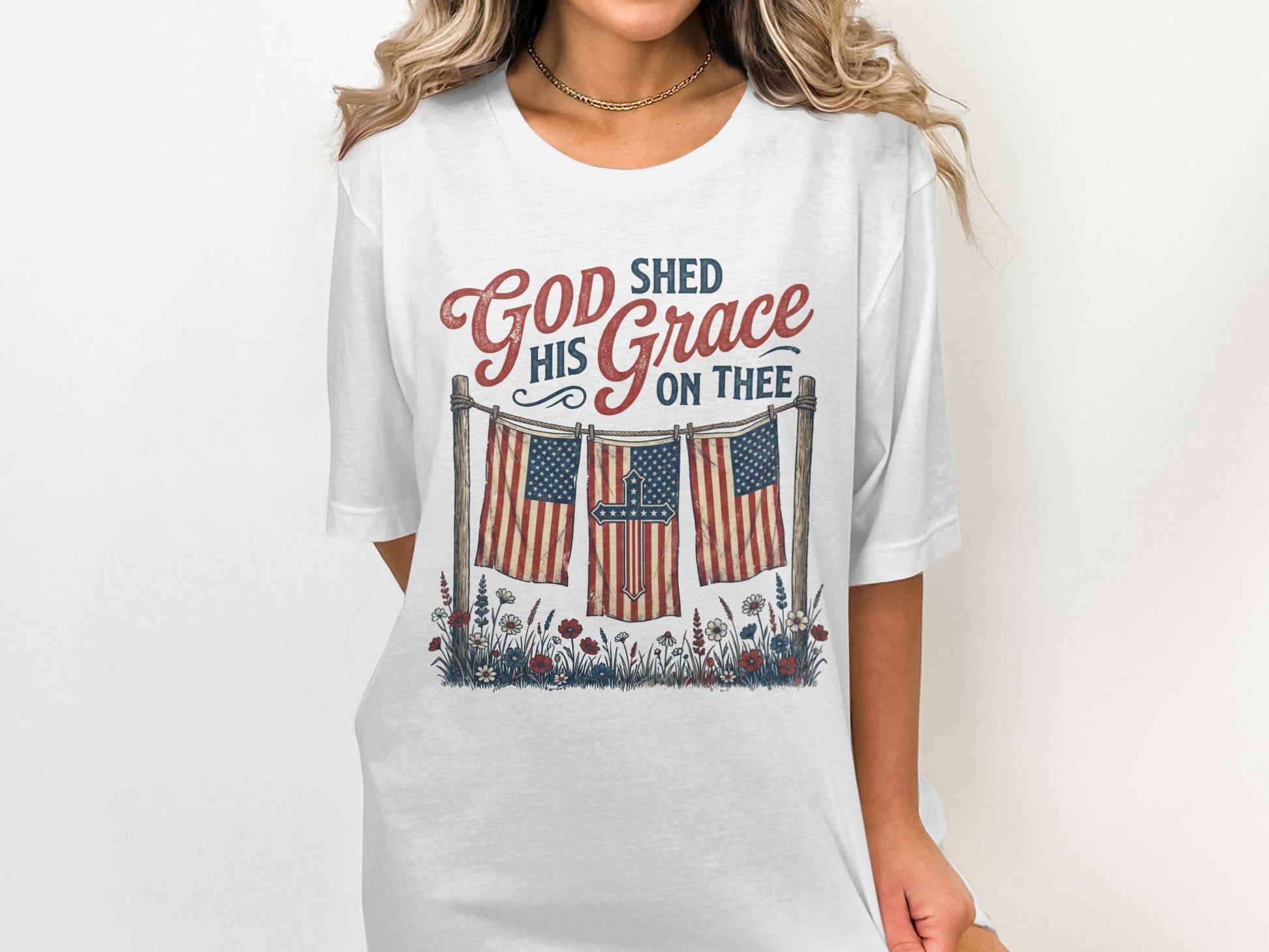 White t-shirt with "God Shed His Grace On Thee" and American flags.