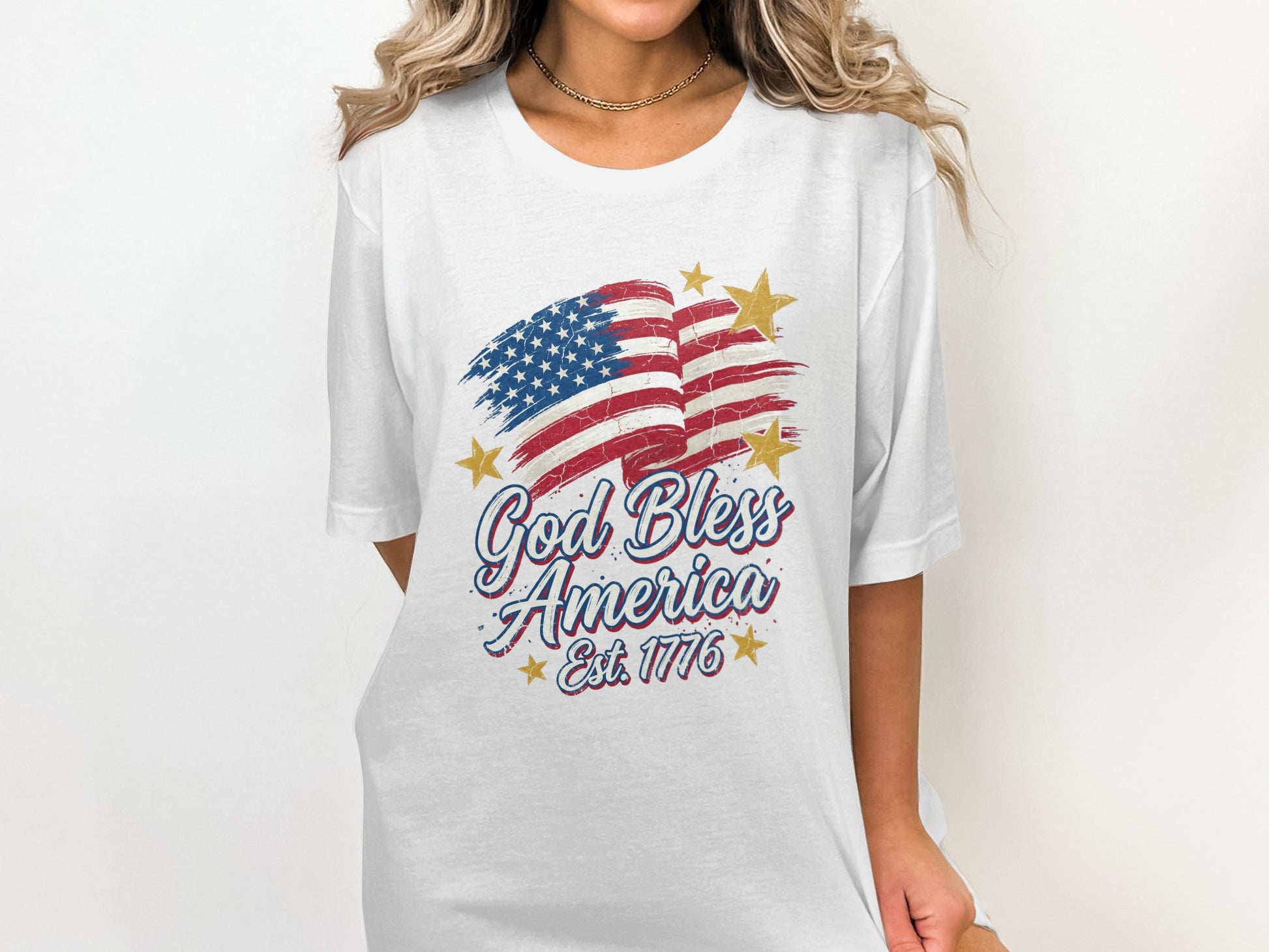 White t-shirt with distressed American flag, stars, and "God Bless America Est. 1776".