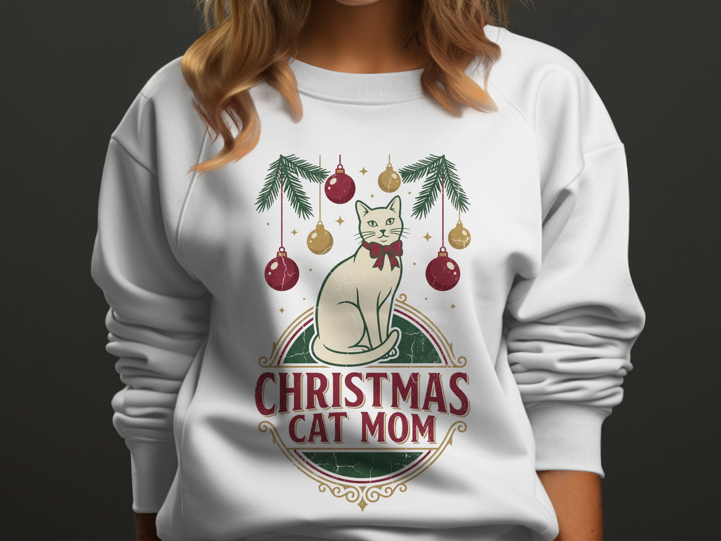 White sweatshirt with Christmas cat mom graphic and ornaments.