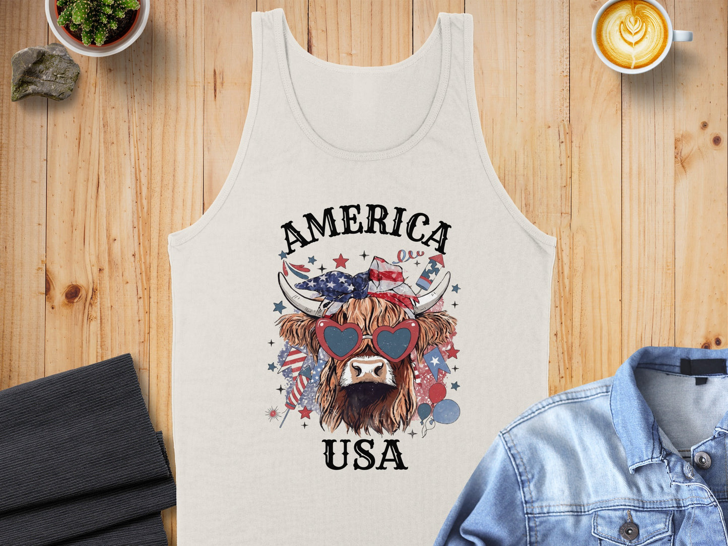 Camper tank top with highland cow graphic wearing heart sunglasses, USA text, and patriotic elements.