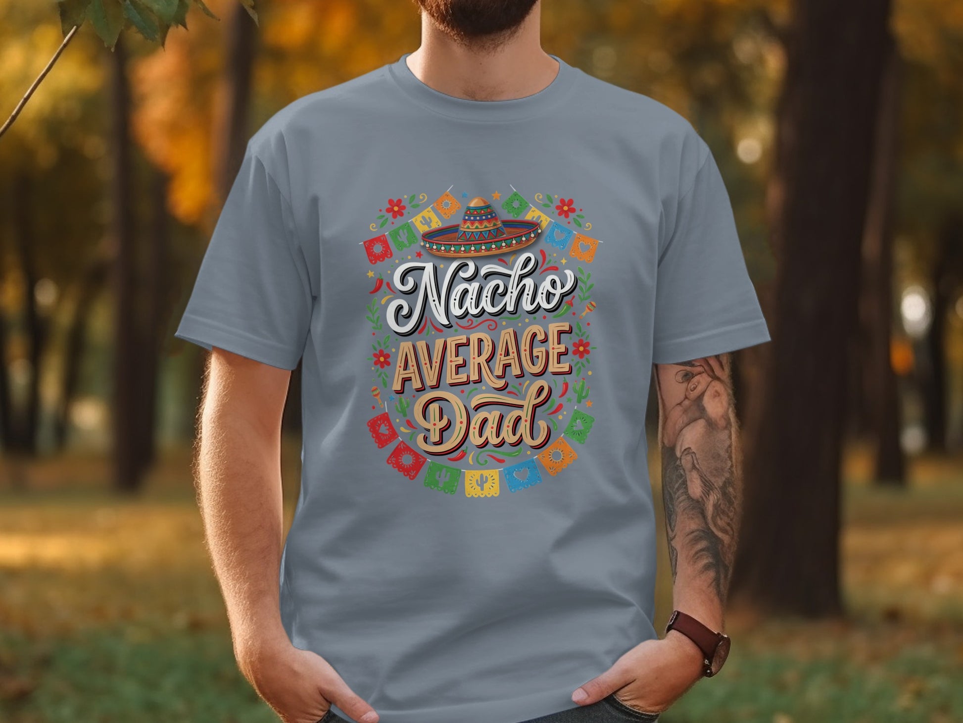 Gray t-shirt with "Nacho Average Dad" text, sombrero, and festive garland.