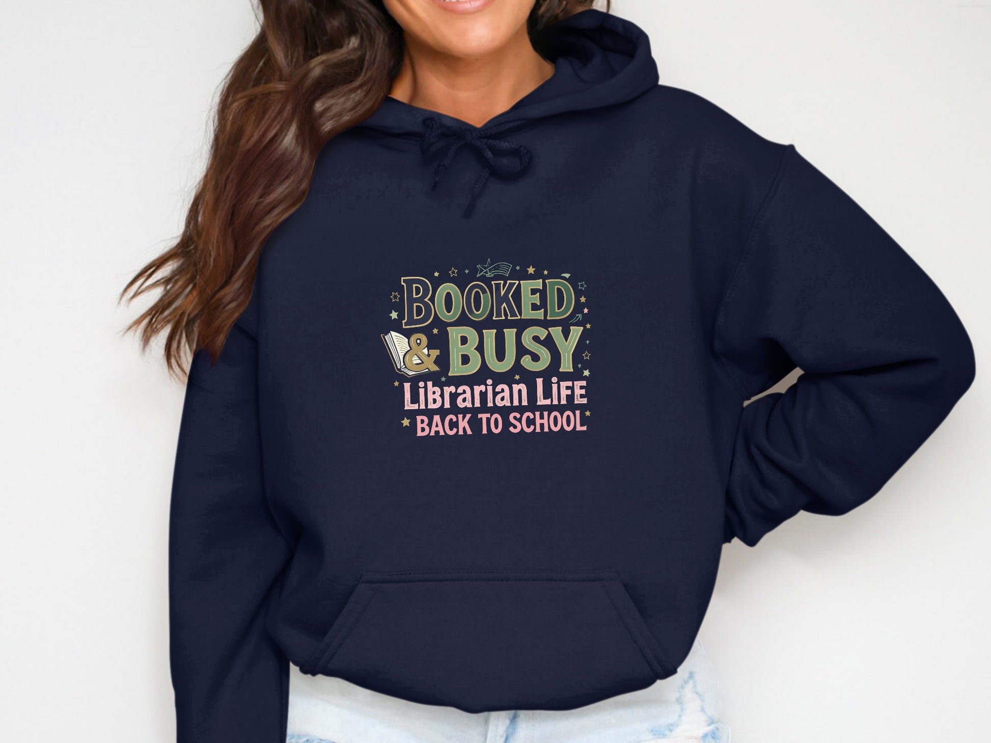 Navy hoodie with "Booked & Busy Librarian Life Back to School" text and graphics.