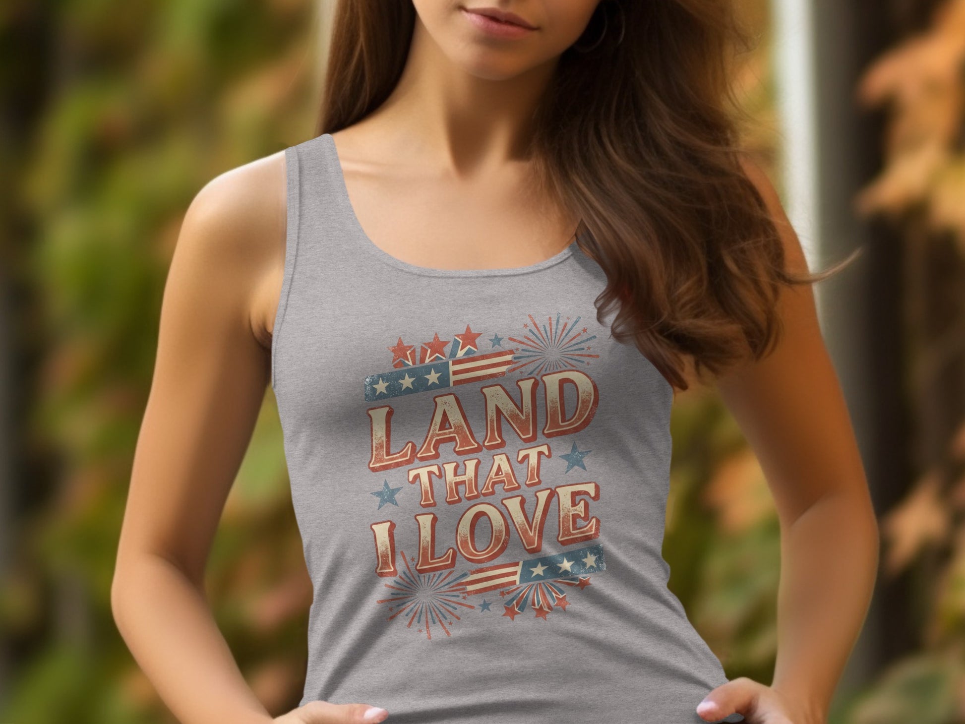 Gray tank top with "Land That I Love" text and patriotic graphics.