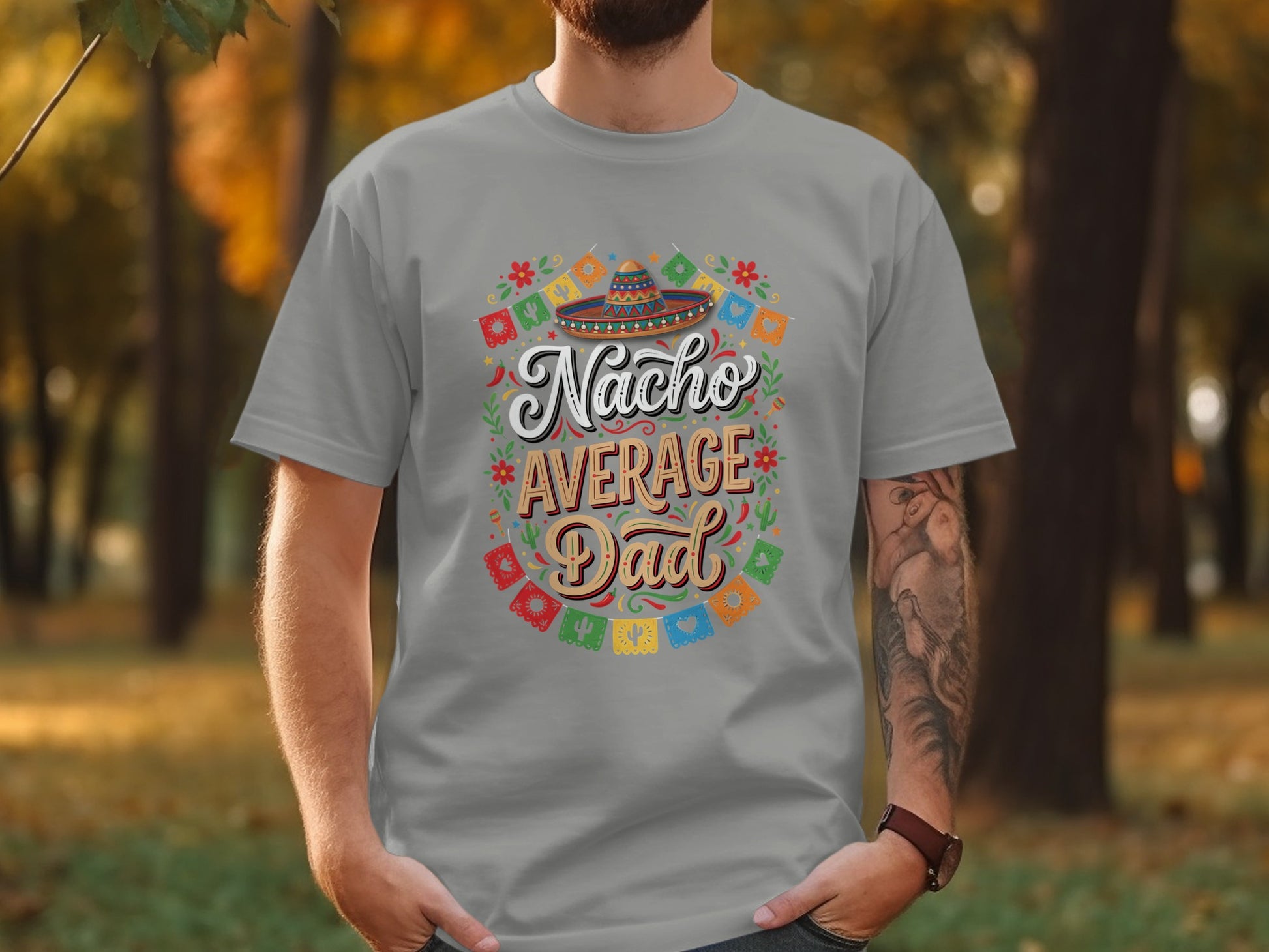 Grey t-shirt with "Nacho Average Dad" text and colorful fiesta decorations.