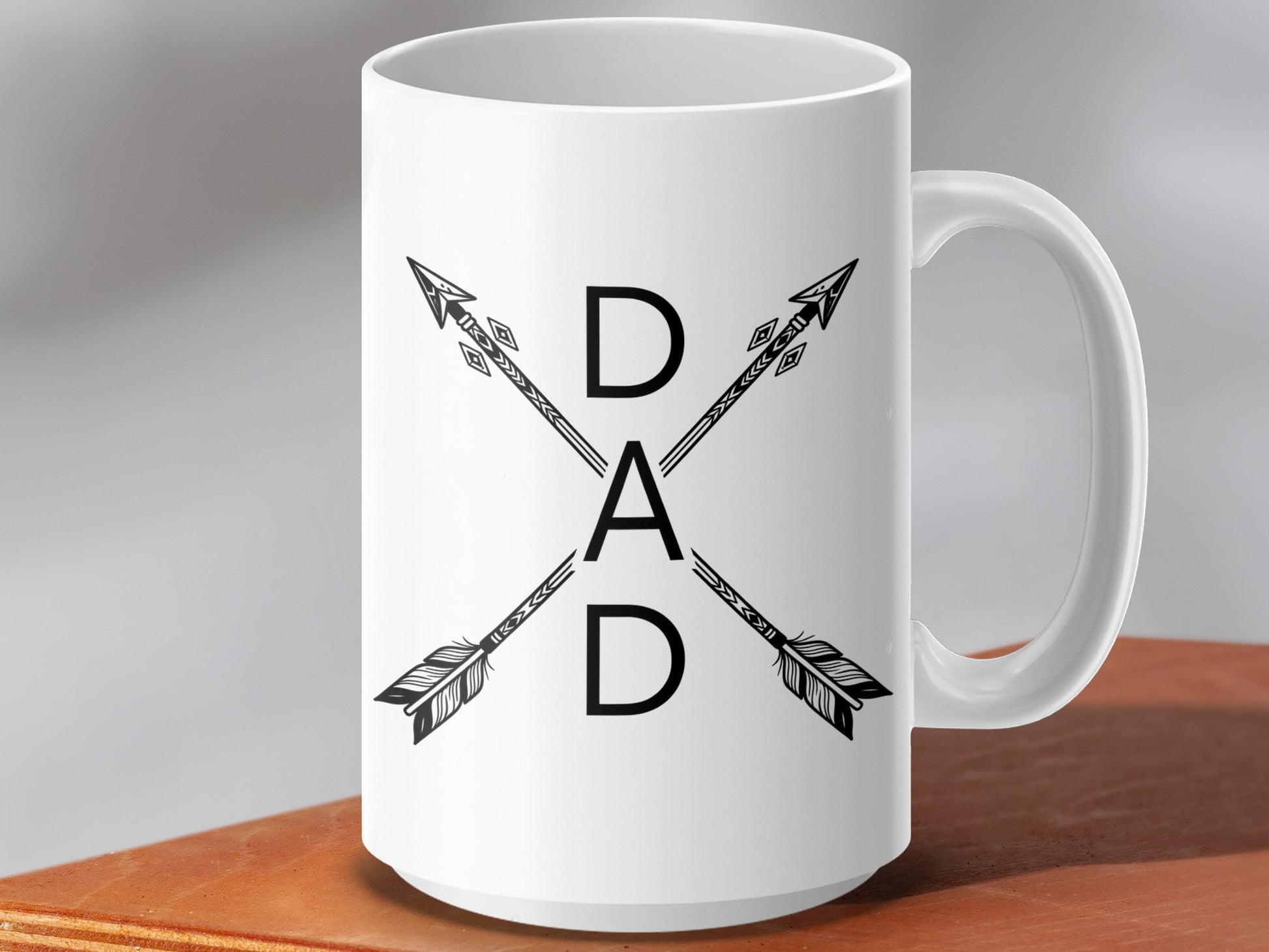 White mug with "DAD" in bold black letters between crossed arrows.