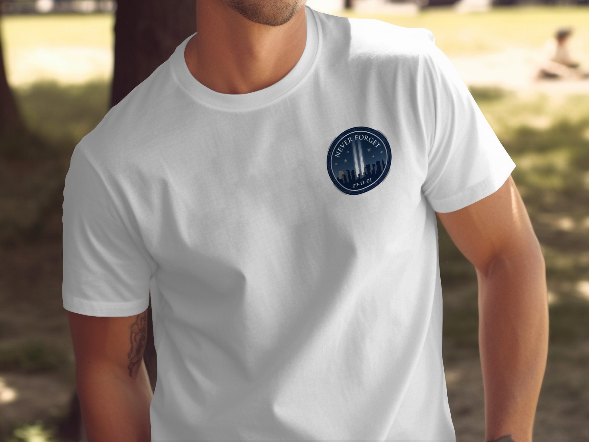White t-shirt depicting the Twin Towers with "Never Forget" and "09-11-01"