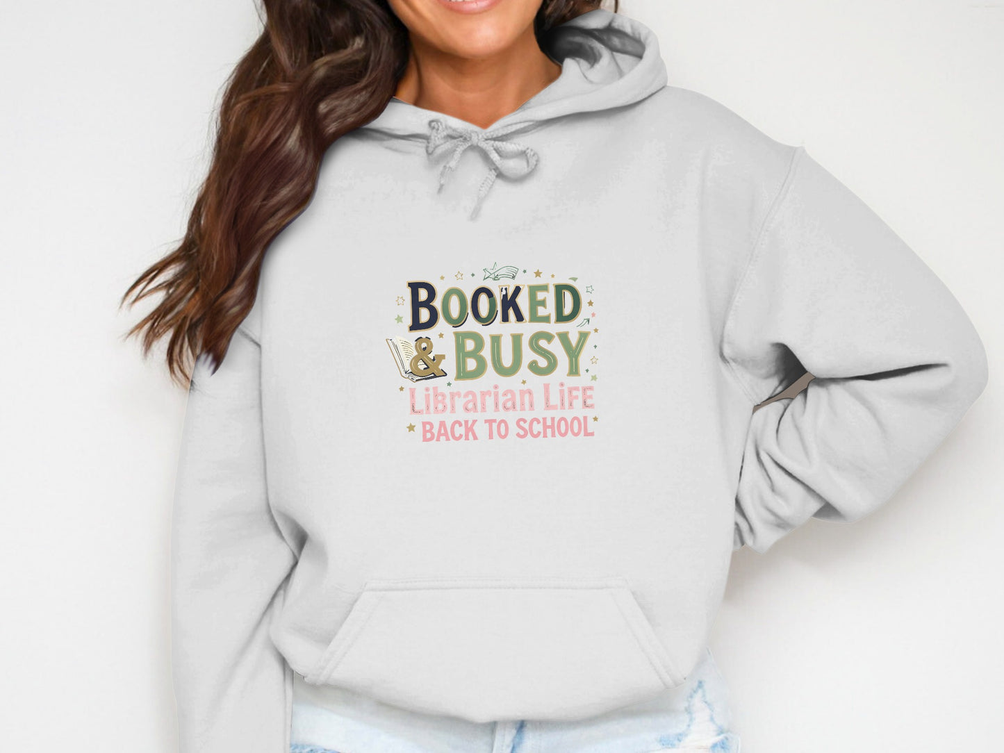 White hoodie with "Booked & Busy Librarian Life Back to School" graphic.