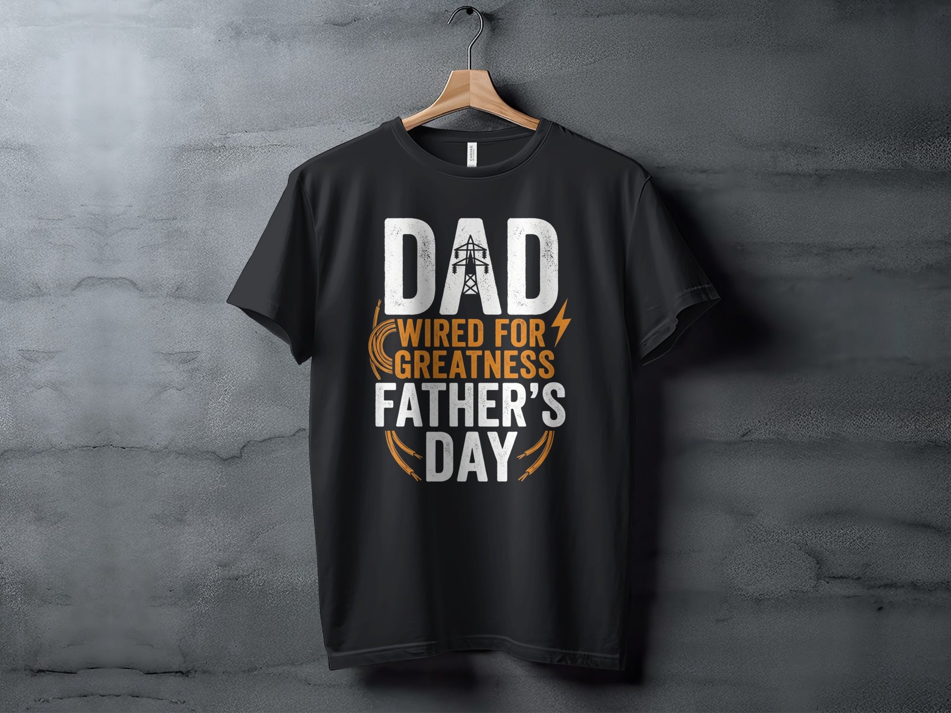Black t-shirt with white text "Dad Wired For Greatness" and orange lightning bolts.