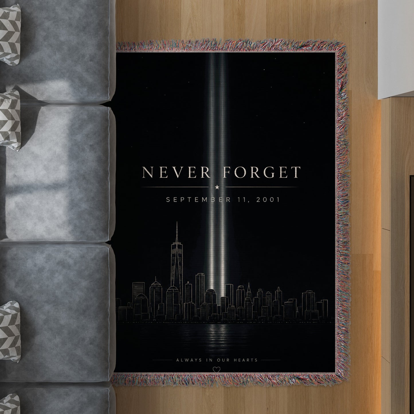 Tribute blanket with "Never Forget September 11, 2001" and NYC skyline.