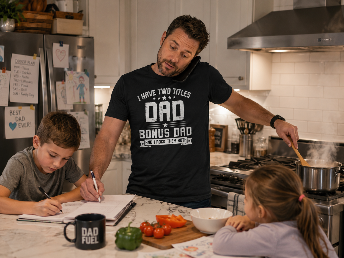 Dad wearing Double Duty Dad Statement T-Shirt multitasking in busy kitchen lifestyle image