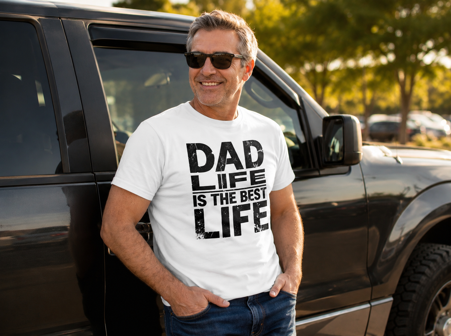 Dad wearing Dad Life Best Life Distressed Graphic Tee leaning against truck lifestyle image